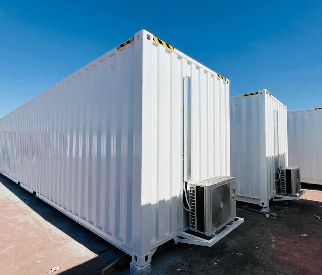 Two refurbished container cabins with air conditioning units, fabricated by DENEVA in Saudi Arabia
